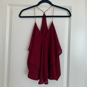Deep red flowy top with gold chain straps, size small